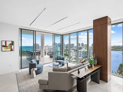 a bathroom with a double vanity sink mirror and shower