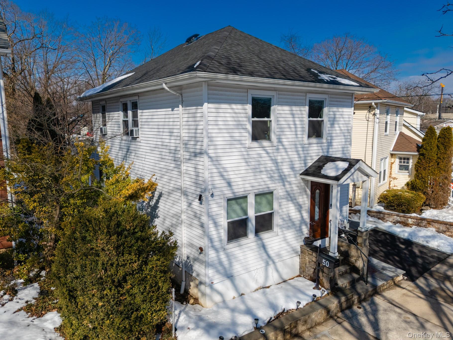 50 Acorn Terrace New Rochelle, NY 10801 - Photo 2 of 27 a front view of a house with garden