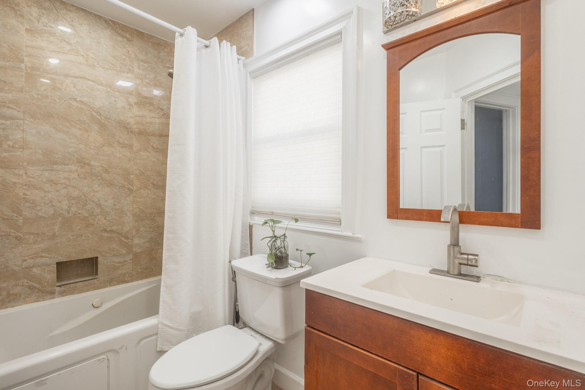 50 Acorn Terrace New Rochelle, NY 10801 - Photo 23 of 27 a bathroom with a sink a toilet and shower