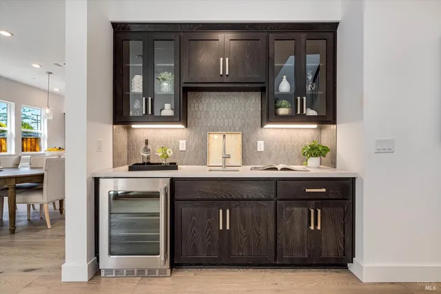 a kitchen with granite countertop a sink and cabinets