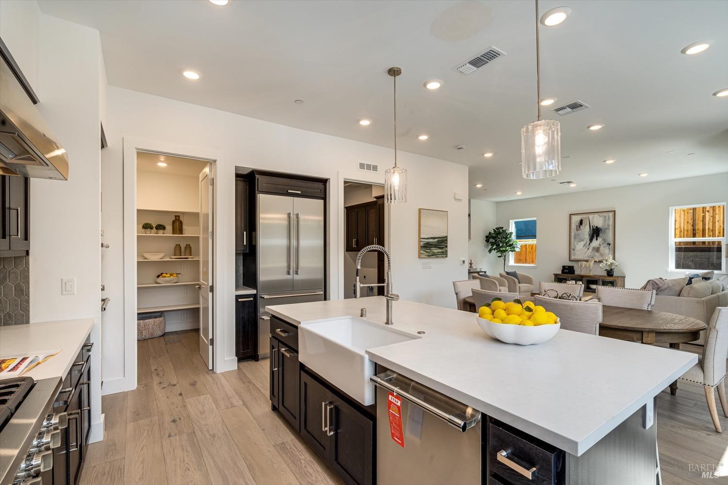 103 Grace Lane Napa, CA 94559 - Photo 18 of 39 a kitchen with a sink a counter space and stainless steel appliances