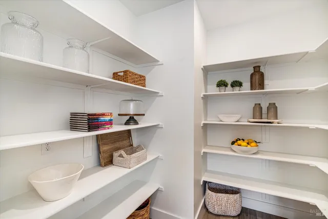 a room with a book shelf and a shelf