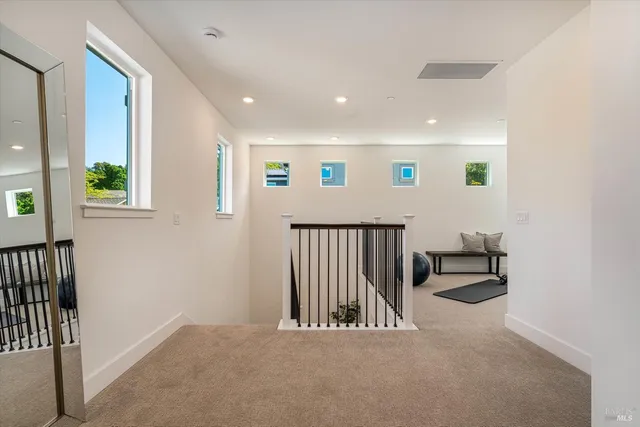 a view of a hallway with windows