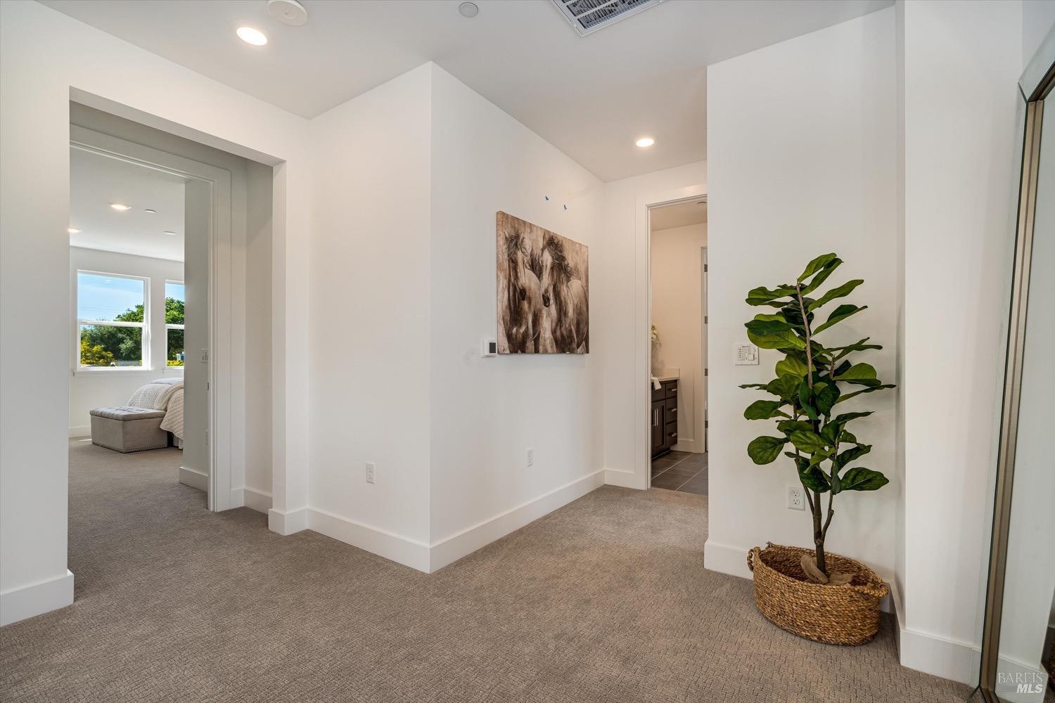 103 Grace Lane Napa, CA 94559 - Photo 26 of 39 a view of a hallway with wooden floor and a potted plant