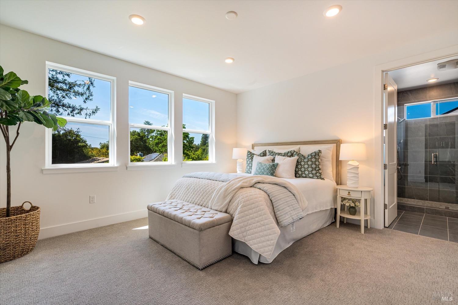 103 Grace Lane Napa, CA 94559 - Photo 27 of 39 a spacious bedroom with a bed and a couch