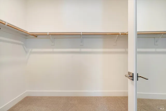 a view of an empty walk in closet