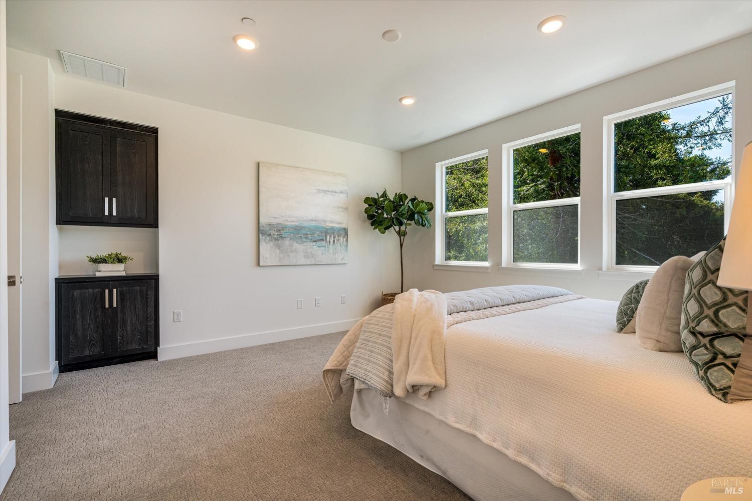 103 Grace Lane Napa, CA 94559 - Photo 30 of 39 a bedroom with a bed and a large window