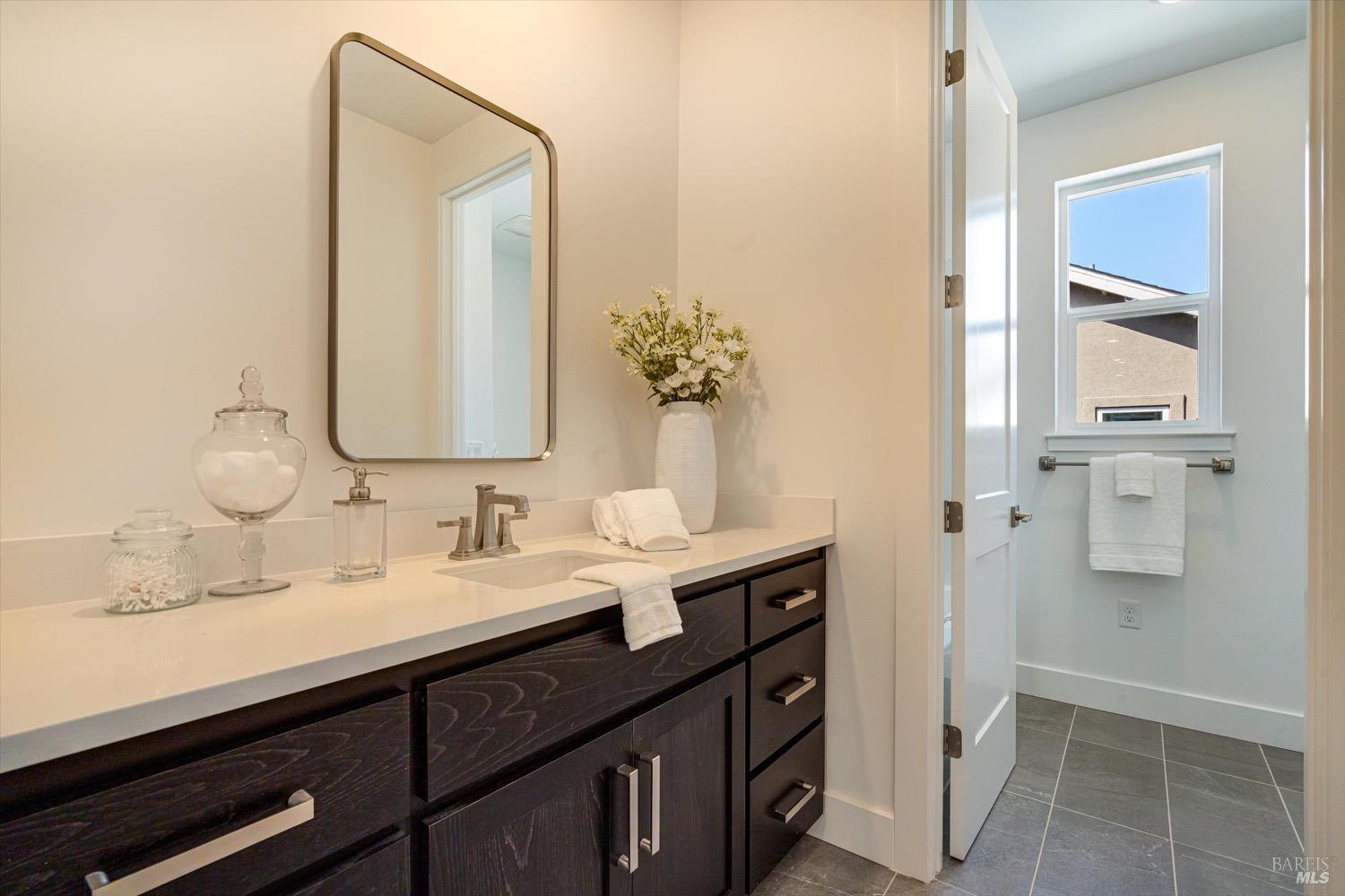 103 Grace Lane Napa, CA 94559 - Photo 32 of 39 a bathroom with a double vanity sink a and mirror