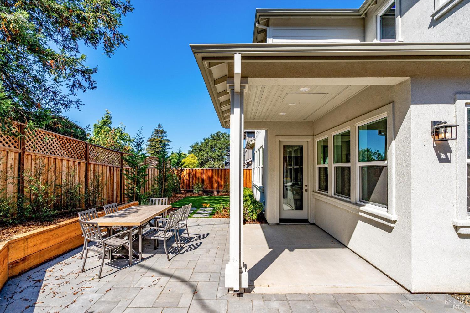 103 Grace Lane Napa, CA 94559 - Photo 34 of 39 a view of a patio with table and chairs with wooden floor and fence