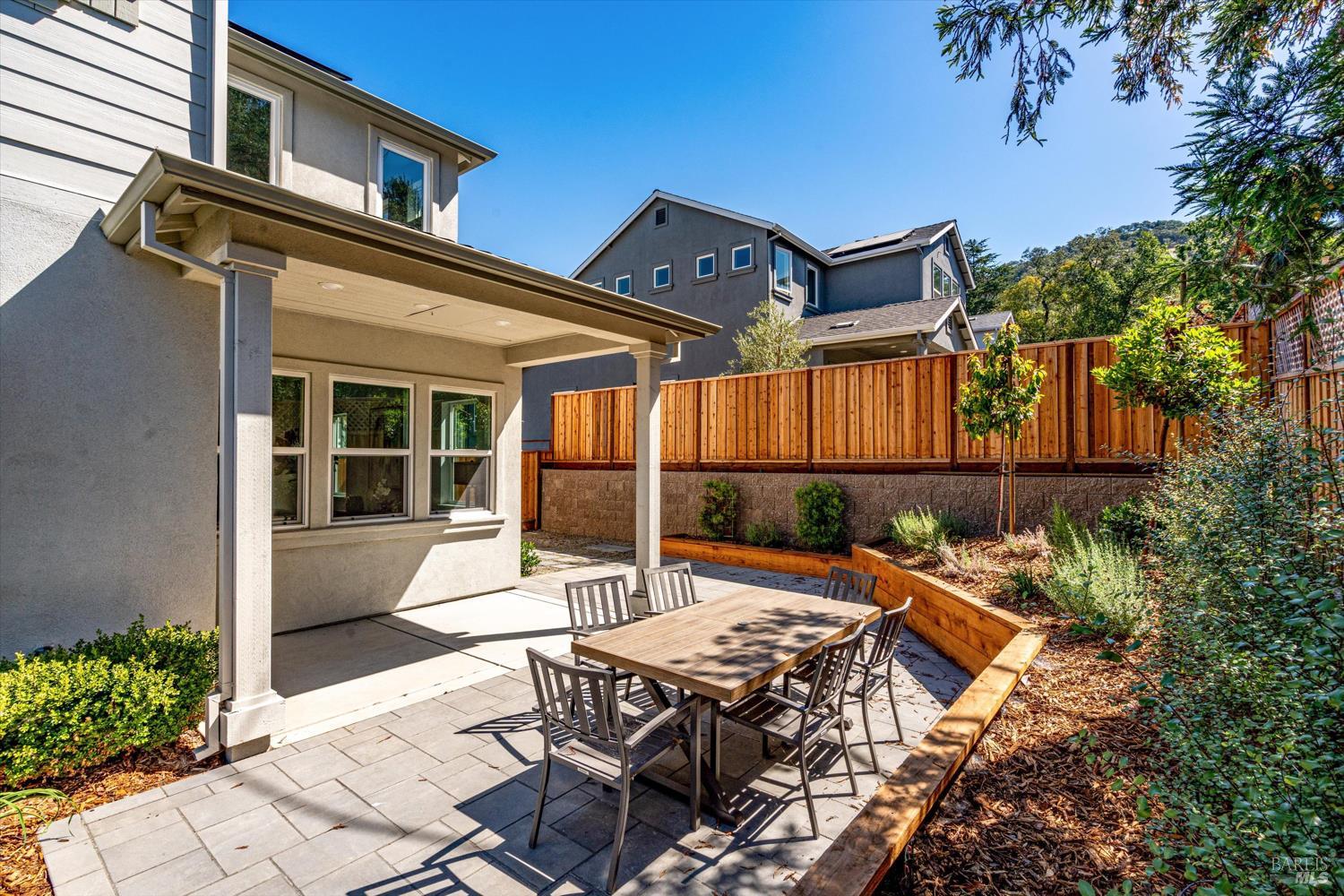 103 Grace Lane Napa, CA 94559 - Photo 36 of 39 a view of a patio with table and chairs with wooden floor and fence