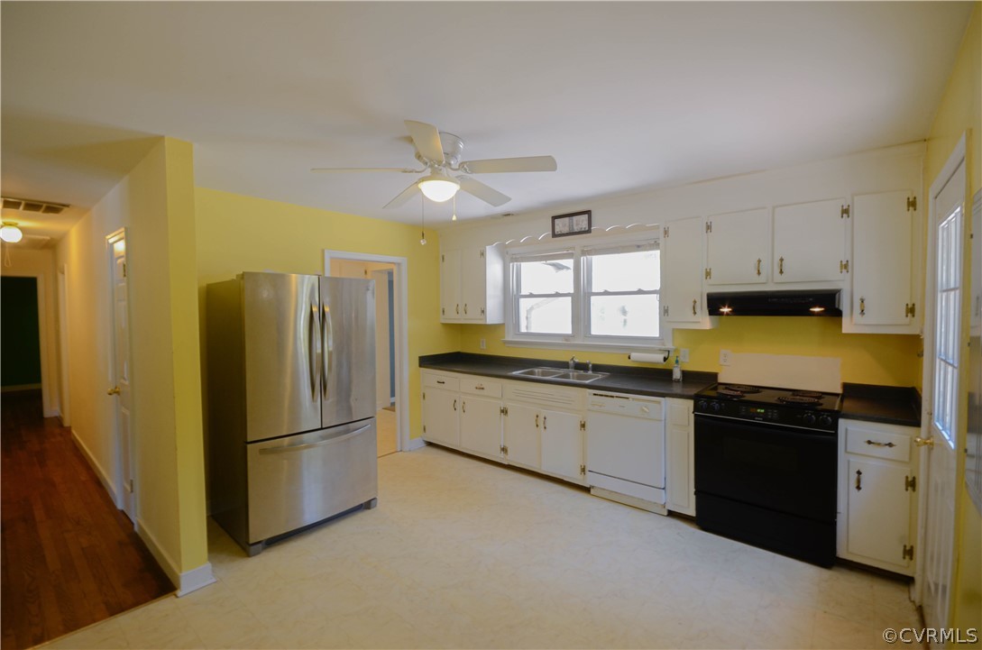 4100 Treely Road Chester, VA 23831 - Photo 11 of 29 a kitchen with granite countertop a refrigerator a sink a stove a dining table and chairs