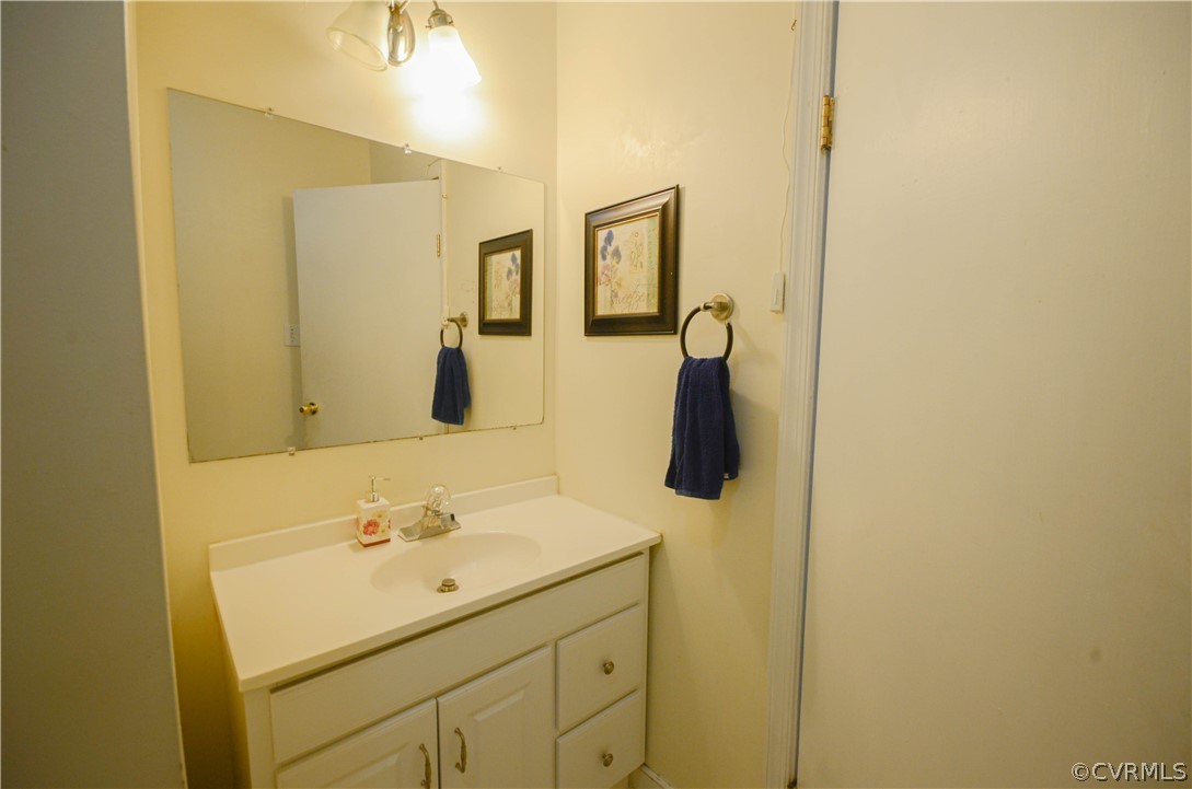 4100 Treely Road Chester, VA 23831 - Photo 17 of 29 a bathroom with a sink and mirror