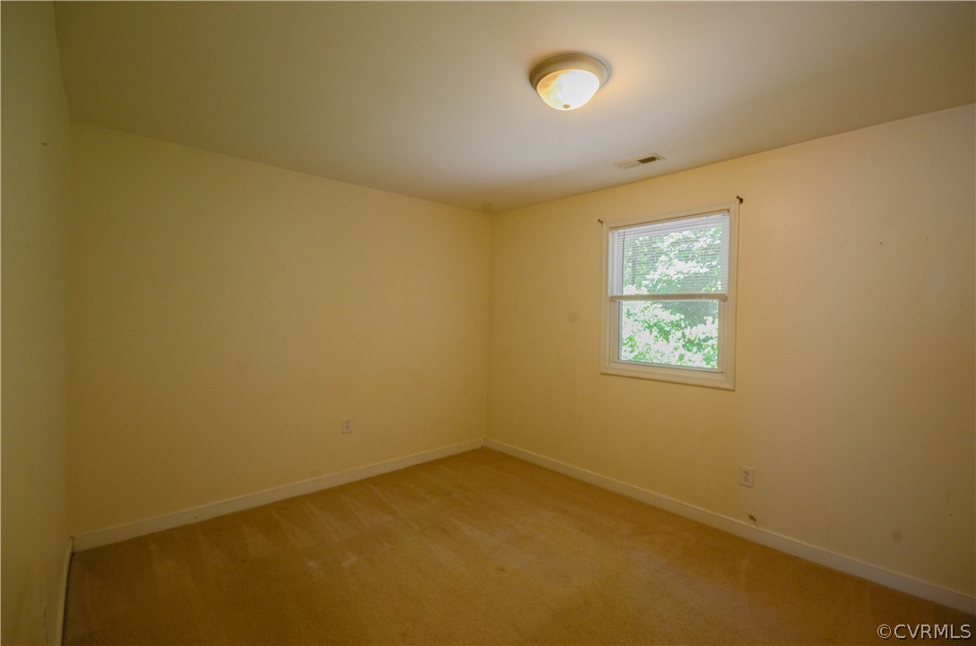 4100 Treely Road Chester, VA 23831 - Photo 19 of 29 an empty room with windows