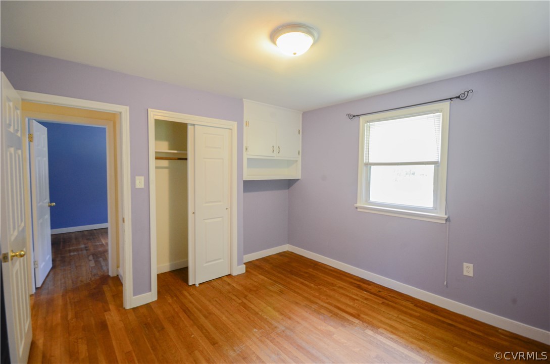 4100 Treely Road Chester, VA 23831 - Photo 26 of 29 an empty room with wooden floor and windows