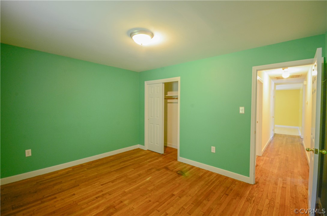 4100 Treely Road Chester, VA 23831 - Photo 27 of 29 a view of a room with wooden floor and a ceiling fan