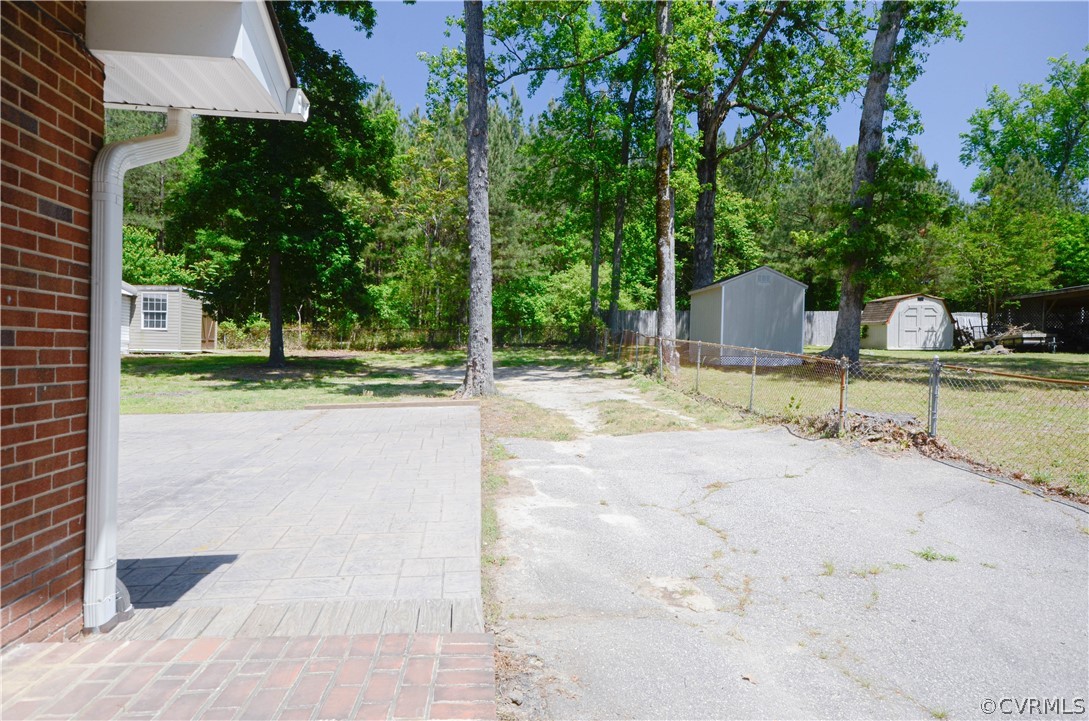 4100 Treely Road Chester, VA 23831 - Photo 5 of 29 a view of a backyard with large trees and plants