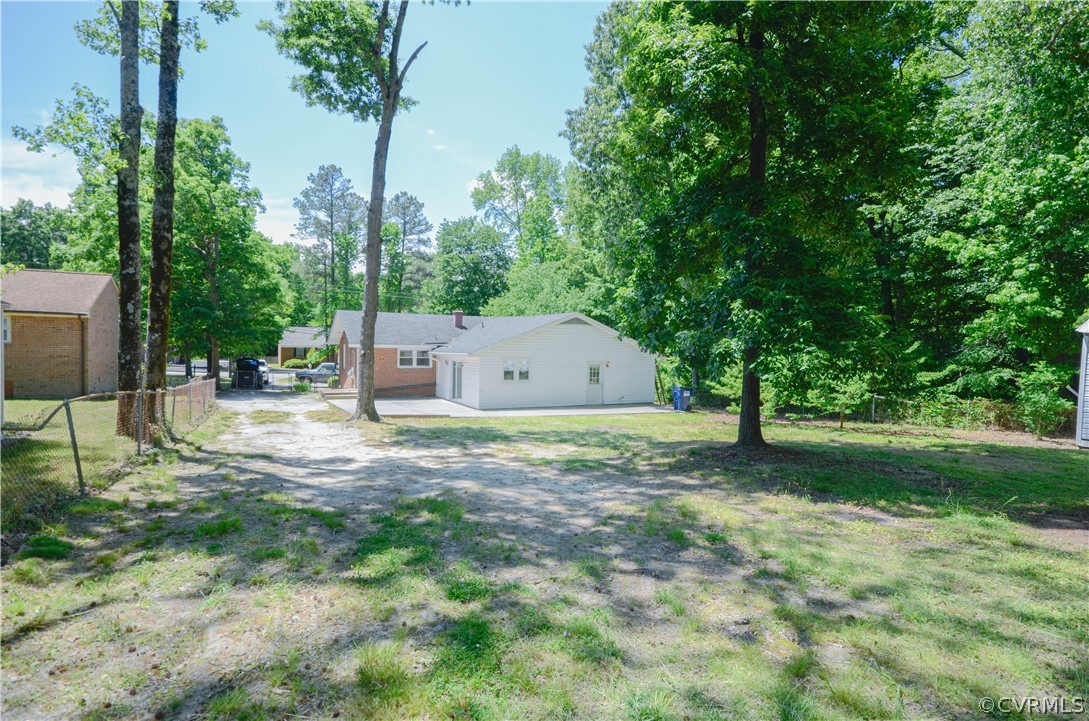 4100 Treely Road Chester, VA 23831 - Photo 7 of 29 a backyard of a house with table and chairs