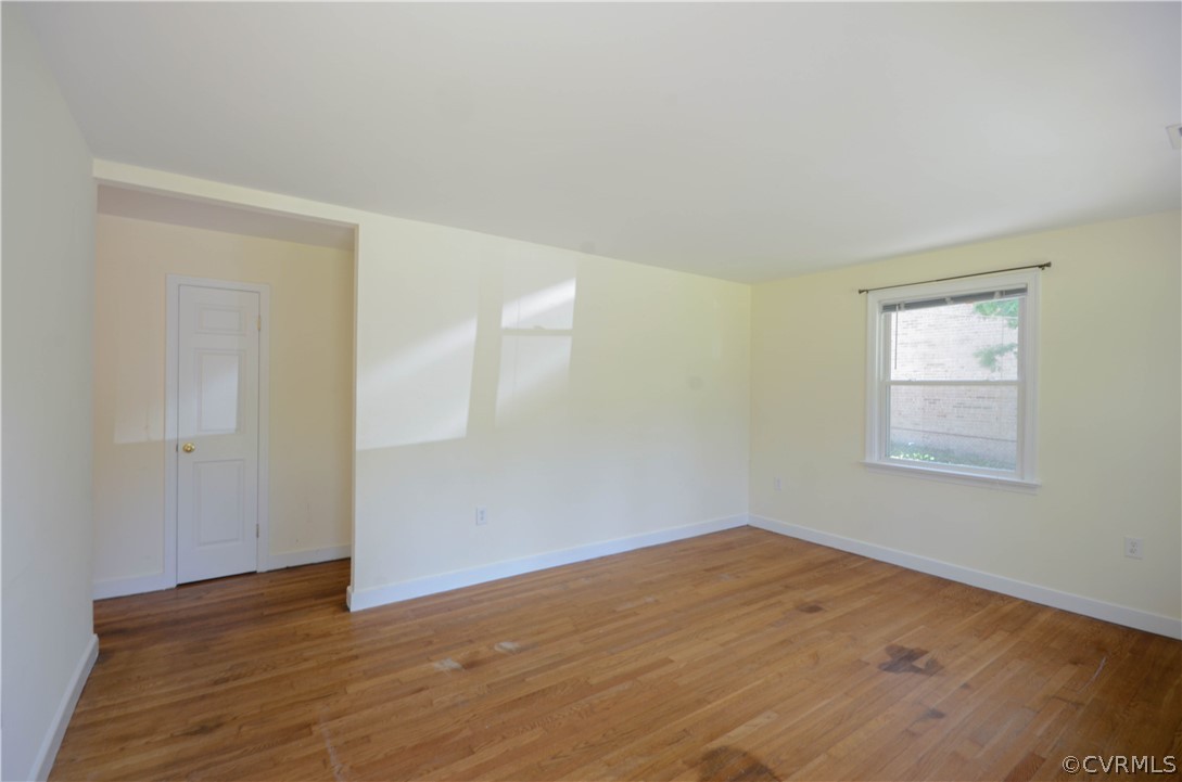 4100 Treely Road Chester, VA 23831 - Photo 8 of 29 a view of an empty room with wooden floor and a window