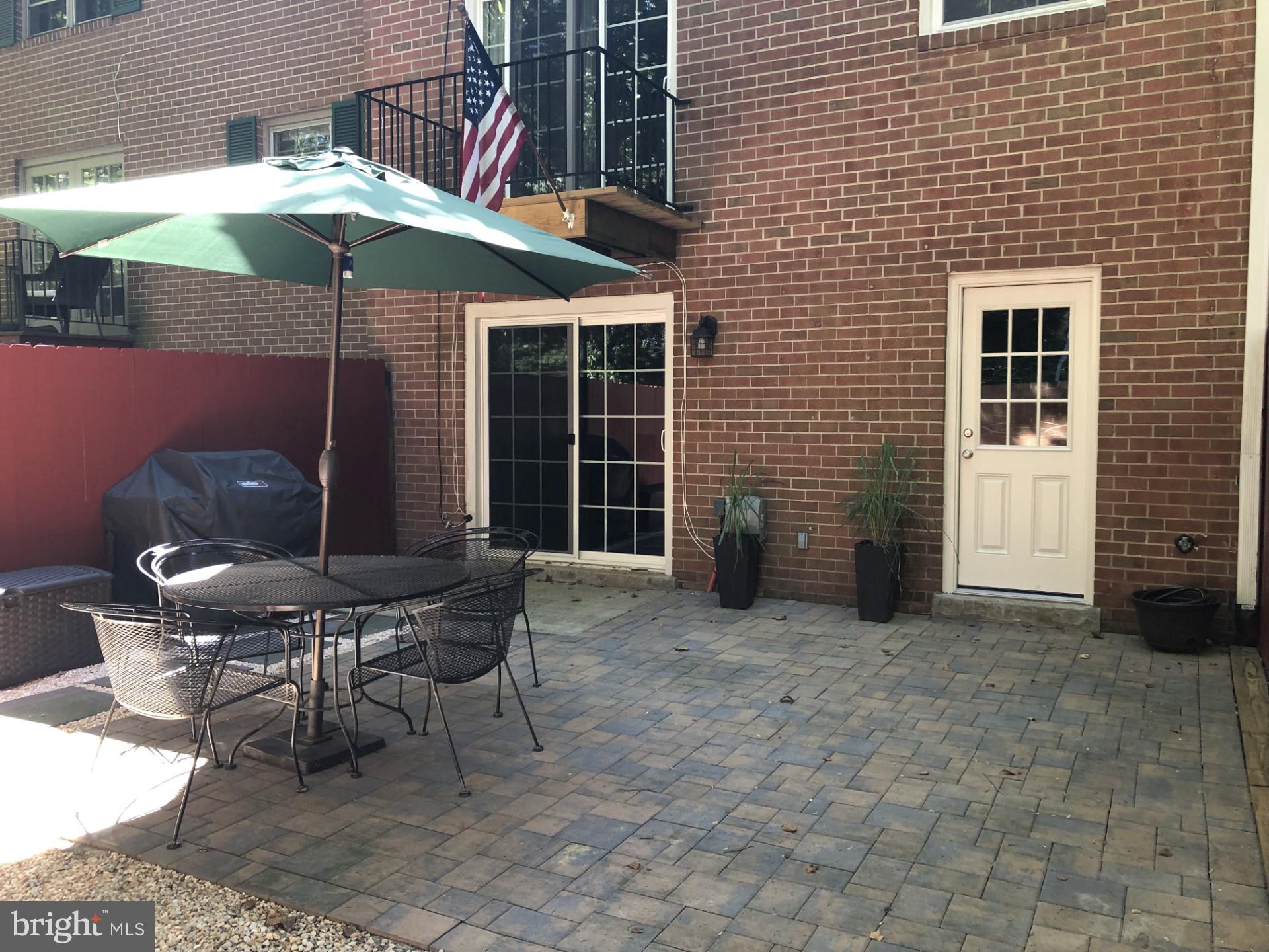 1815 Wainwright Drive Reston, VA 20190 - Photo 30 of 31 Paved patio-wood deck from kitchen