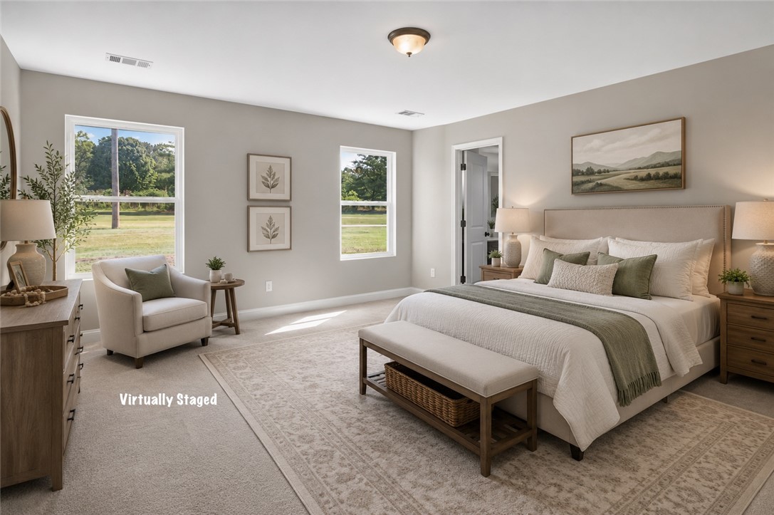 2007 Aberdeen Lane Walhalla, SC 29691 - Photo 15 of 41 A tranquil primary bedroom with soft, natural light and a serene landscape vista.