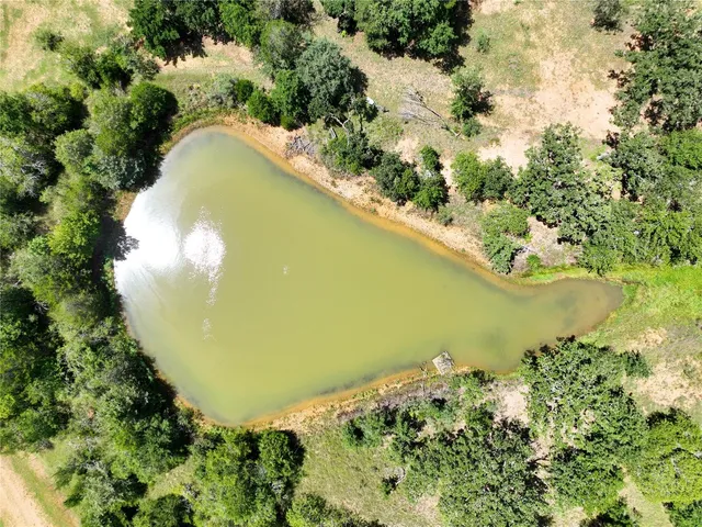 a view of a lake with a yard