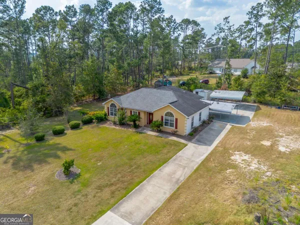 aerial view of a house with swimming pool