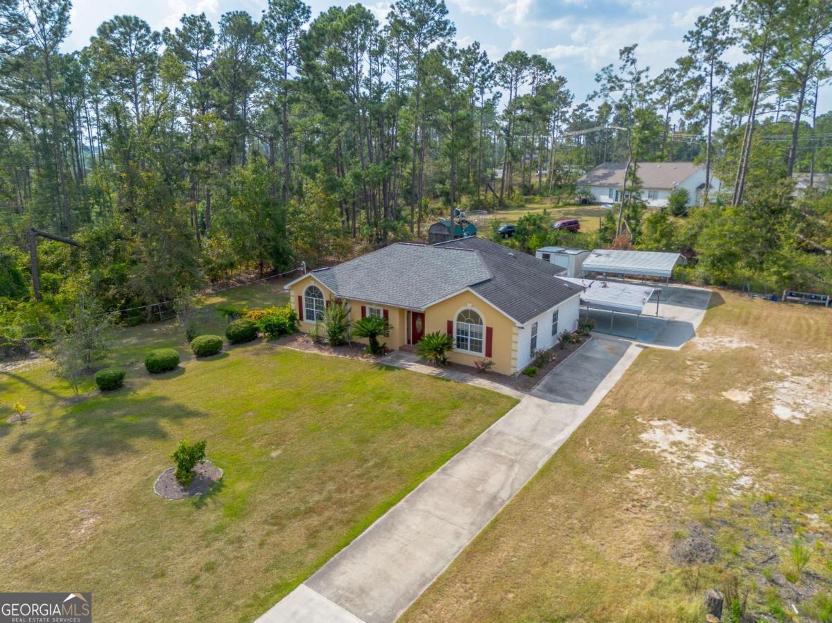 301 Ridge Lane Douglas, GA 31533 - Photo 2 of 26 aerial view of a house with swimming pool