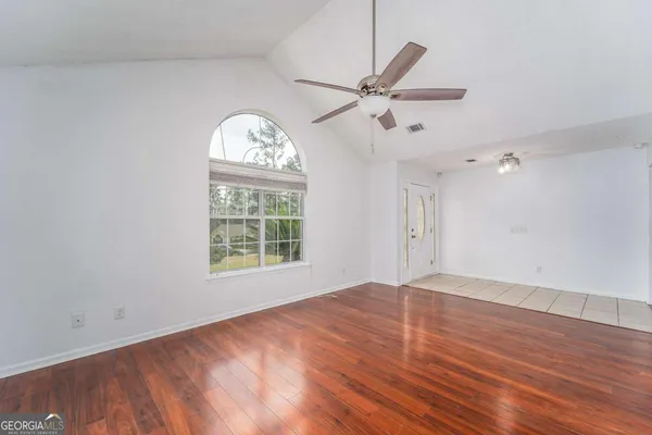 a view of kitchen with wooden floor and window