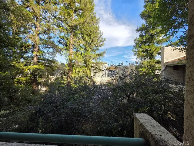 a view of balcony with a tree