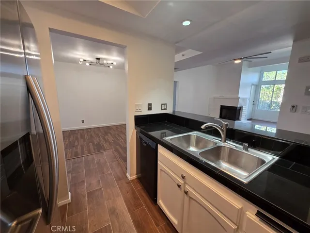 a kitchen that has a sink and a stove