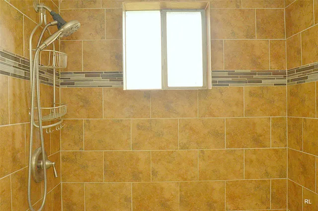 a bathroom with a shower curtain and a sink