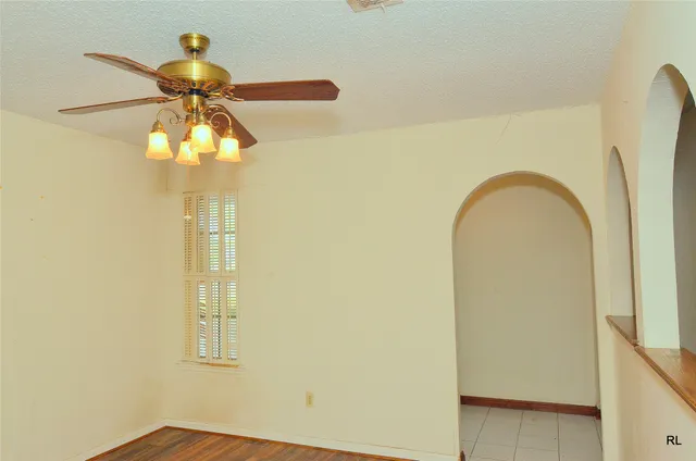 a view of a back yard with wooden floor and a window