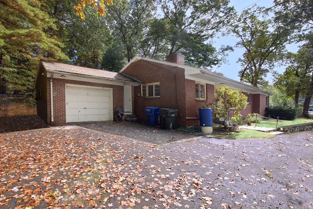 151 West Allen Ridge Road Springfield, MA 01118 - Photo 1 of 30 a view of a house with a yard and large tree