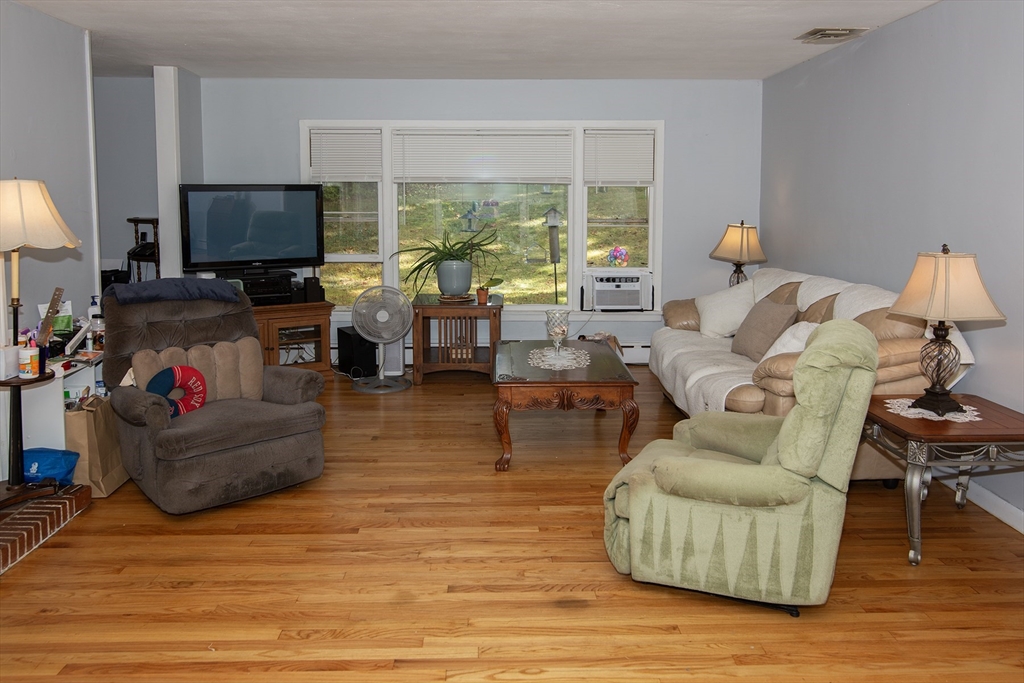 151 West Allen Ridge Road Springfield, MA 01118 - Photo 11 of 30 a living room with furniture and a flat screen tv