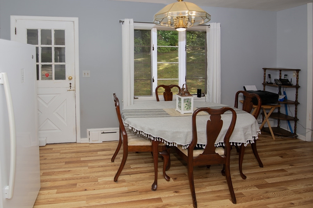 151 West Allen Ridge Road Springfield, MA 01118 - Photo 16 of 30 a dining room with furniture and wooden floor