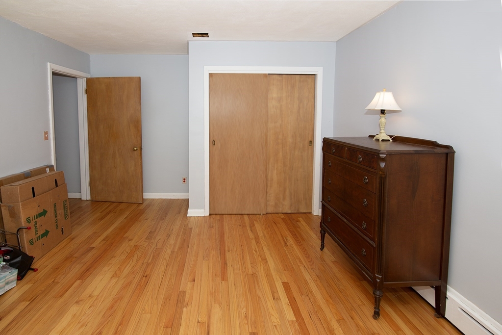 151 West Allen Ridge Road Springfield, MA 01118 - Photo 20 of 30 a view of an empty room with wooden floor
