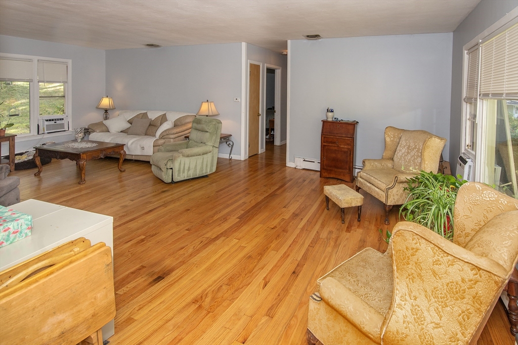 151 West Allen Ridge Road Springfield, MA 01118 - Photo 8 of 30 a living room with furniture and a table