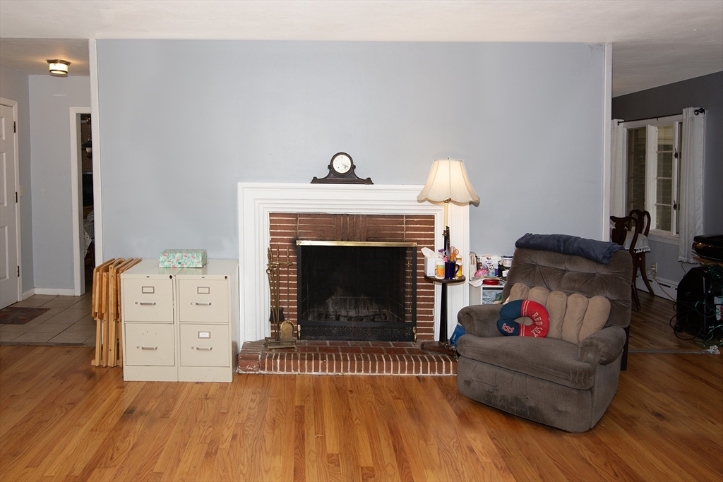 151 West Allen Ridge Road Springfield, MA 01118 - Photo 10 of 30 a living room with furniture and a fireplace