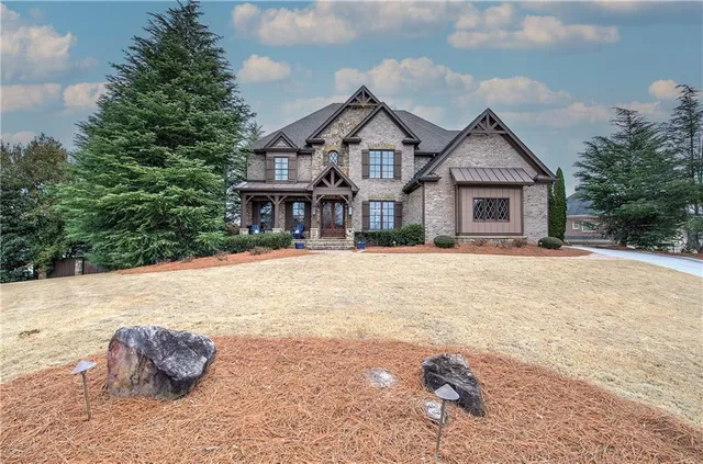 a front view of a house with a yard