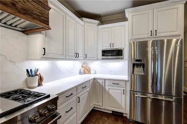 a view of a hallway with a large window and wooden floor