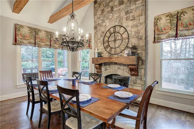 a view of a dining room with furniture and window