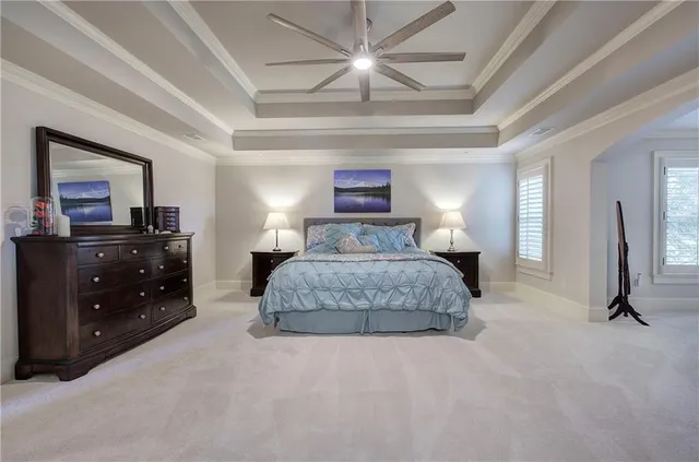 a view of a backyard with table and chairs and potted plants