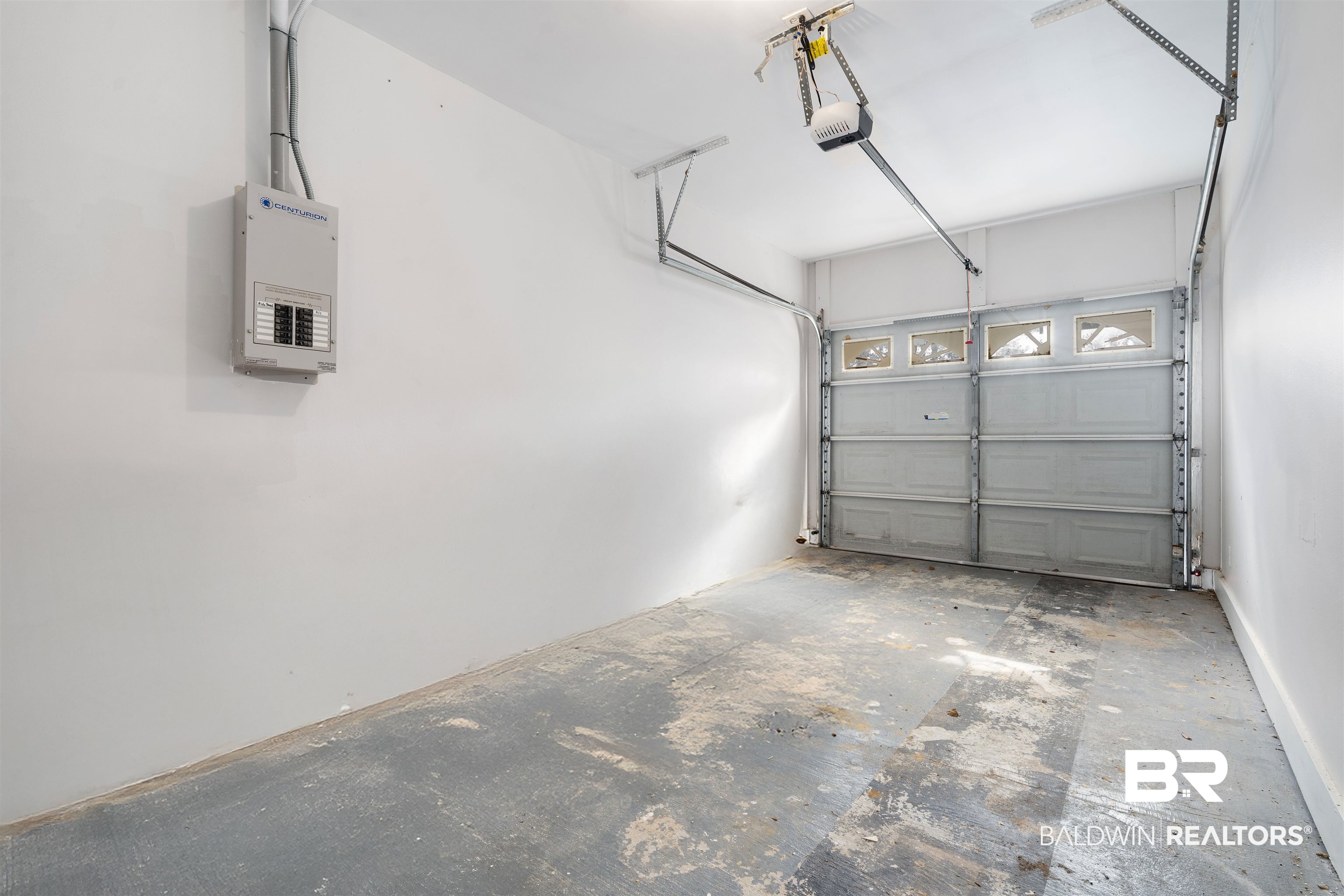 250 North Spring Lake Drive Mobile, AL 36695 - Photo 25 of 29 Garage featuring a new garage door opener, and generator control panel