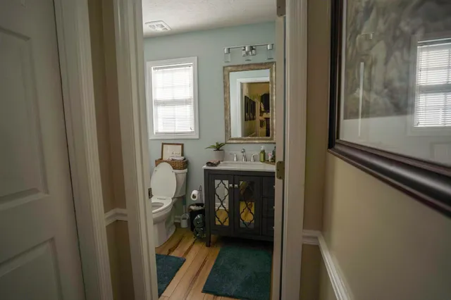 a en suite bathroom with a sink a mirror and a shower