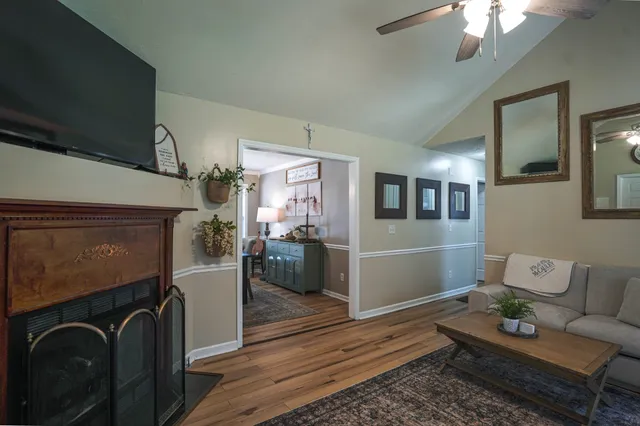 a living room with furniture and a fireplace