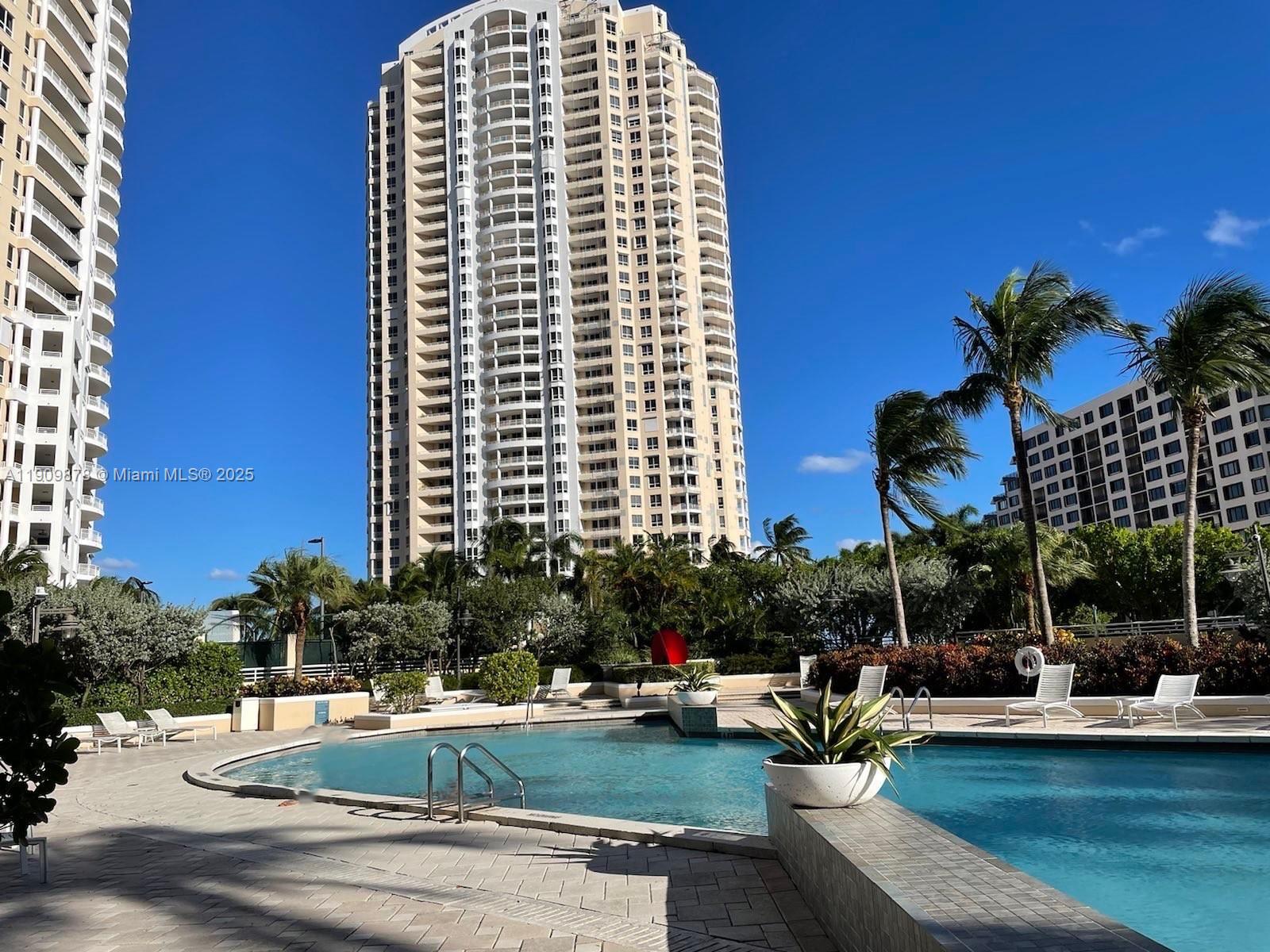 888 Brickell Key Drive, Unit 2610 Miami, FL 33131 - Photo 23 of 37 a view of a swimming pool with a patio