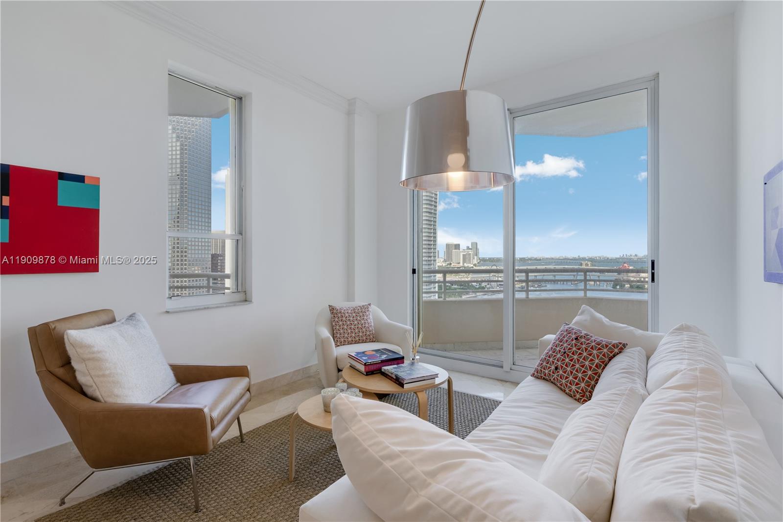 888 Brickell Key Drive, Unit 2610 Miami, FL 33131 - Photo 3 of 37 a living room with furniture and a lamp