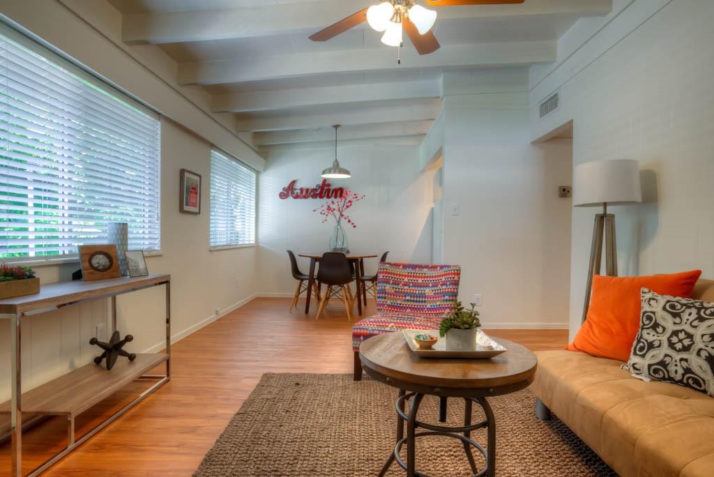 3011 Whitis Avenue, Unit 202 Austin, TX 78705 - Photo 5 of 6 a living room with furniture and a table