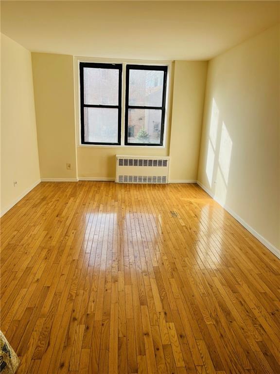 2330 Voorhies Avenue, Unit 1C Brooklyn, NY 11235 - Photo 7 of 10 a view of an empty room and wooden floor