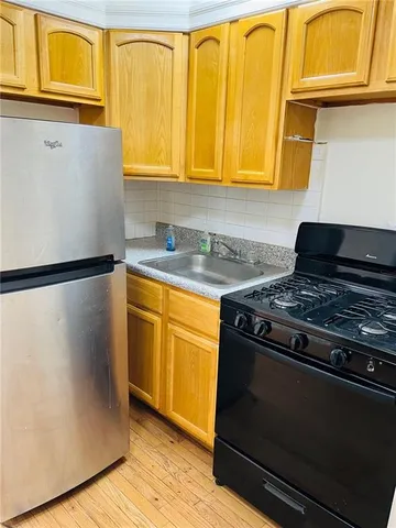 a kitchen with stainless steel appliances granite countertop a stove and a microwave